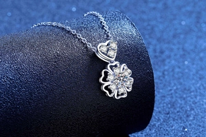 Macro shot of S925 sterling silver snowflake pendant with moissanite on blue stand