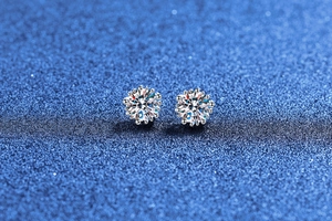 Macro shot of S925 sterling silver moissanite stud earrings in a classic snowflake design