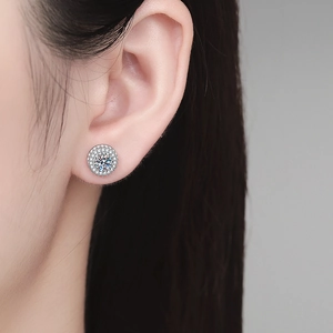 S925 sterling silver halo stud earrings with moissanite center stone on model