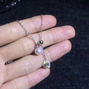 Elegant S925 sterling silver Y-necklace featuring a white pearl and moissanite tassel pendant