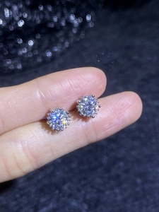 Macro view of S925 sterling silver moissanite stud earrings in sunburst cluster design