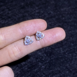 Elegant 925 sterling silver heart-shaped moissanite stud earrings shown on finger