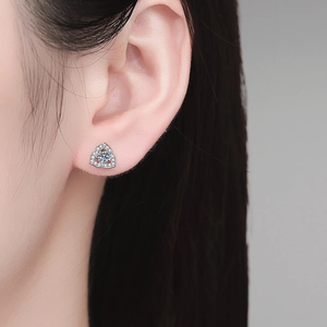 Elegant s925 silver flower stud earrings with moissanite crystals shown on a model