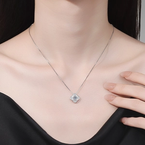 S925 sterling silver four-leaf clover moissanite pendant necklace on model's neck
