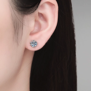 Classic round moissanite stud earrings in s925 sterling silver worn by a model