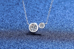 Macro shot of S925 sterling silver bubble pendant necklace with sparkling moissanite stones