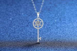 Detailed view of S925 silver key pendant necklace with moissanite pavé and center stone