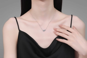 Close-up of S925 sterling silver moissanite bubble pendant on a female model's neck