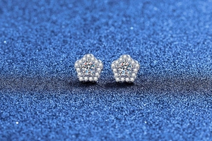 Macro detail of S925 sterling silver flower stud earrings with brilliant moissanite stones