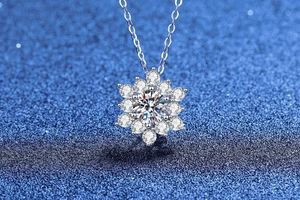 Macro shot of S925 sterling silver snowflake pendant with 1ct moissanite center stone