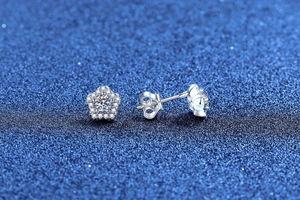 Macro view of S925 sterling silver flower earrings with sparkling moissanite stones