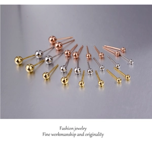Macro detail of 925 sterling silver ball studs in gold, silver and rose gold finishes
