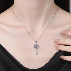 Elegant 925 sterling silver key pendant necklace with sparkling moissanite cluster