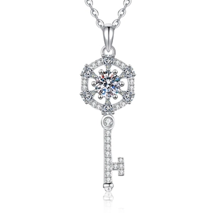 Elegant silver 925 key pendant necklace with sparkling pavé moissanite on white background