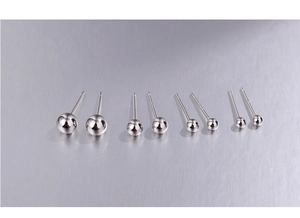 Detail view of four pairs of 925 sterling silver ball studs in varying size diameters