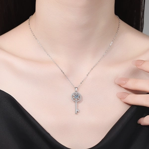 Elegant S925 silver necklace featuring a 1ct Moissanite diamond key pendant on a model