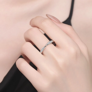 S925 sterling silver moissanite twisted ring with pave stones worn by a model