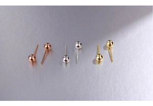 Detailed view of 925 silver ball stud earrings in rose gold, silver, and gold finishes