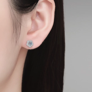 S925 sterling silver moissanite stud earring in flower shape on female model ear