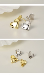 Macro shot of S925 sterling silver heart studs in gold and silver showing hallmark