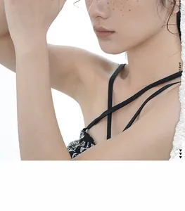 Detail of black and white geometric pattern camisole with woven texture and thin straps