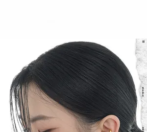 Detail of 18K gold-plated double-layered ear cuff with a smooth polished mirror finish
