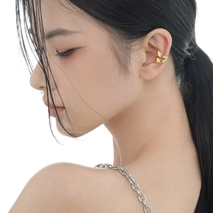 Minimalist double-layered gold triangle ear cuff for women on a white background