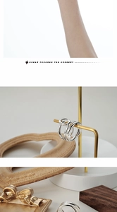 Detailed view of S925 sterling silver ring showing intertwined geometric line design