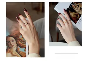 Artistic double-layer mobius rings in gold and silver finish with elegant curved design