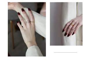 Detail of S925 silver irregular wave ring and golden twisted rope ring set on finger