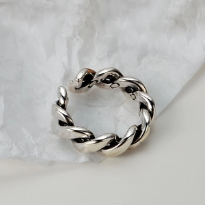 S925 Sterling Silver minimalist twisted rope ring with adjustable open design on paper