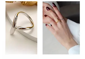 Dettaglio di anelli aperti minimalisti in argento S925 oro e argento con design a V