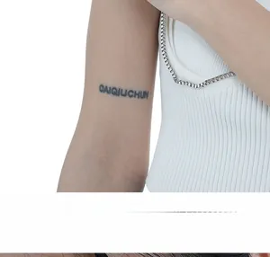 Detailed view of white ribbed knit vest featuring modern silver metal square chain strap