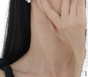Close-up of S925 sterling silver asymmetrical cheese earrings with shell pearls