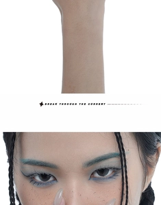 Detailed view of avant-garde makeup with blue eyeliner and artificial freckles on skin