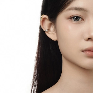Minimalist ear cuff set with teardrop zircon stones on elegant female model