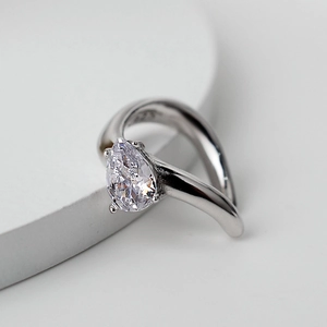 Elegant S925 sterling silver open ring featuring a pear-cut cubic zirconia stone