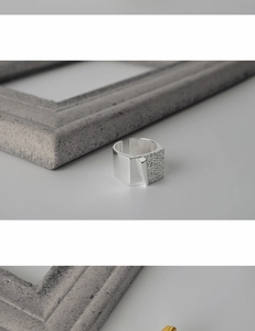 Detailed view of S925 silver ring featuring unique origami texture and hammered finish