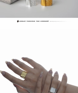 Detail of S925 sterling silver ring with unique hammered texture and layered metal design