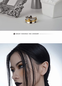 Artistic detail of S925 silver wrapped ring with gold accents and industrial design