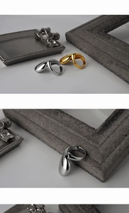 Detailed view of irregular lava-style S925 silver rings in gold and silver finishes