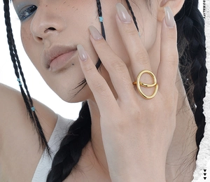 Close-up of golden S925 silver ring featuring an abstract geometric hollow design