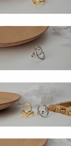 Macro shot of S925 hallmark on minimalist silver and gold hollow geometric rings
