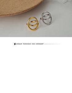 Close-up of dual-ring intertwined design in polished gold and silver minimalist finishes