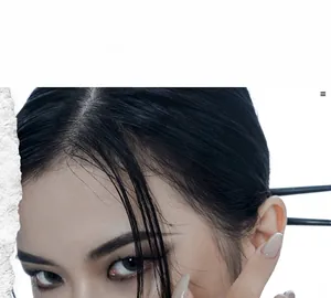 Detail of a minimalist black U-shaped hair pin in a modern updo hair styling