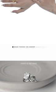 Detail of S925 silver ring with rectangular zircon and hollow frame on ceramic tray