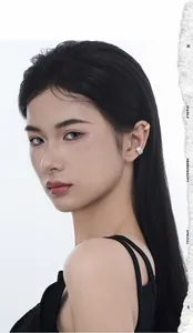 Detail view of S925 sterling silver ear cuffs with irregular molten lava texture on ear bone
