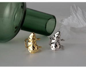 Artistic S925 sterling silver rings with irregular lava texture and abstract face design