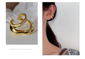 Irregular S925 silver ear cuff with gold plating and sparkling cubic zirconia details