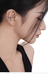 Minimalist silver S925 concave geometric ear cuff on model with polished mirror finish